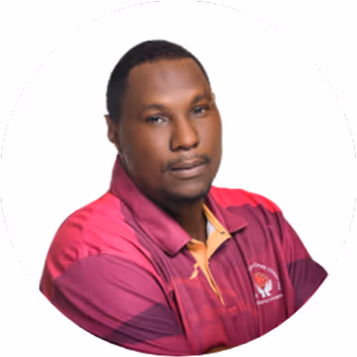 Portrait of a man wearing a maroon and red collared sports shirt with a logo on the chest, posing against a white background.